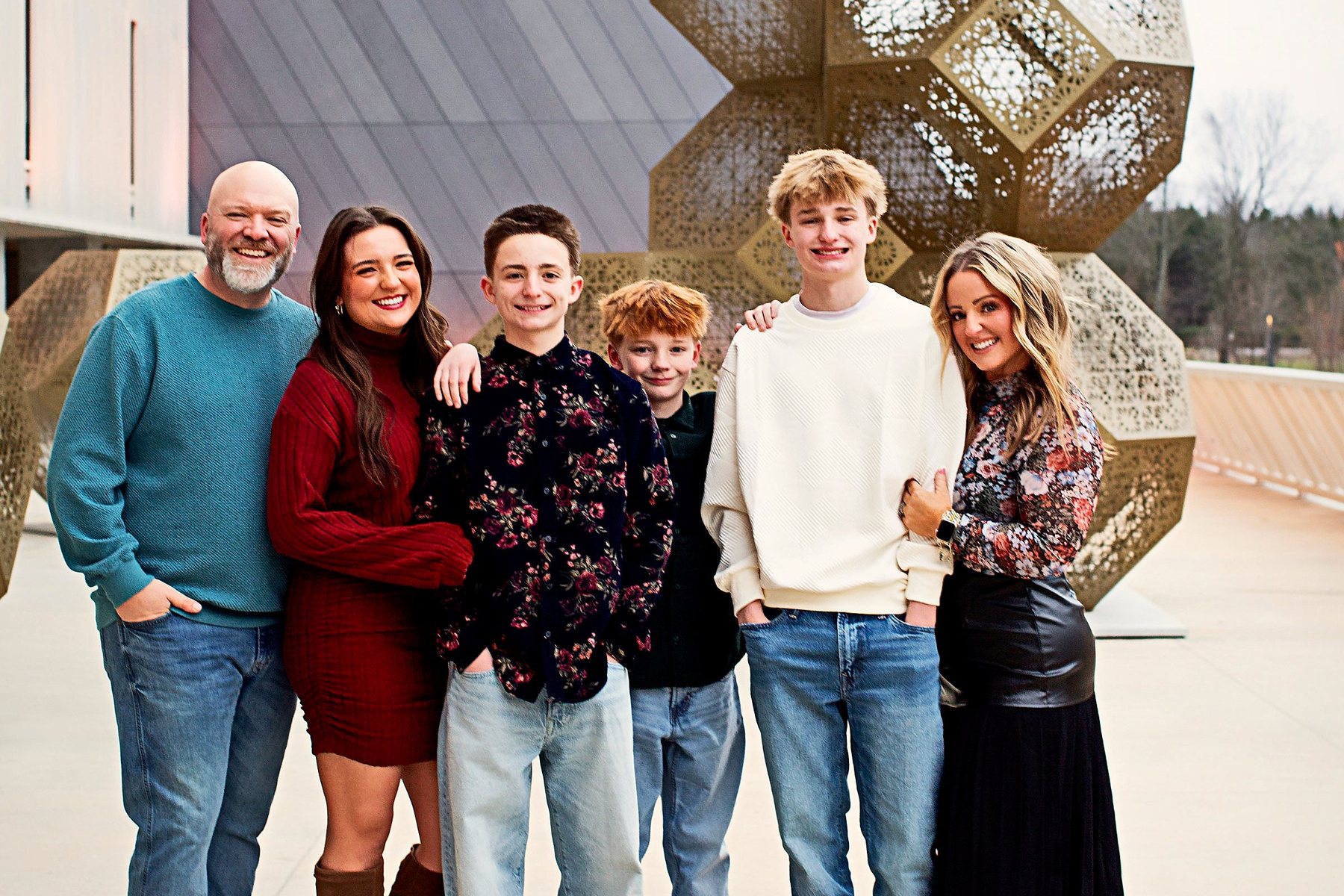 Katy with her husband and their four kids outside an art museum